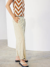 Load image into Gallery viewer, Skatïe Carrot fit trouser with button detail at hem Flax
