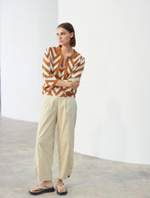 Load image into Gallery viewer, Skatïe Carrot fit trouser with button detail at hem Flax
