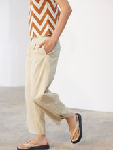 Load image into Gallery viewer, Skatïe Carrot fit trouser with button detail at hem Flax
